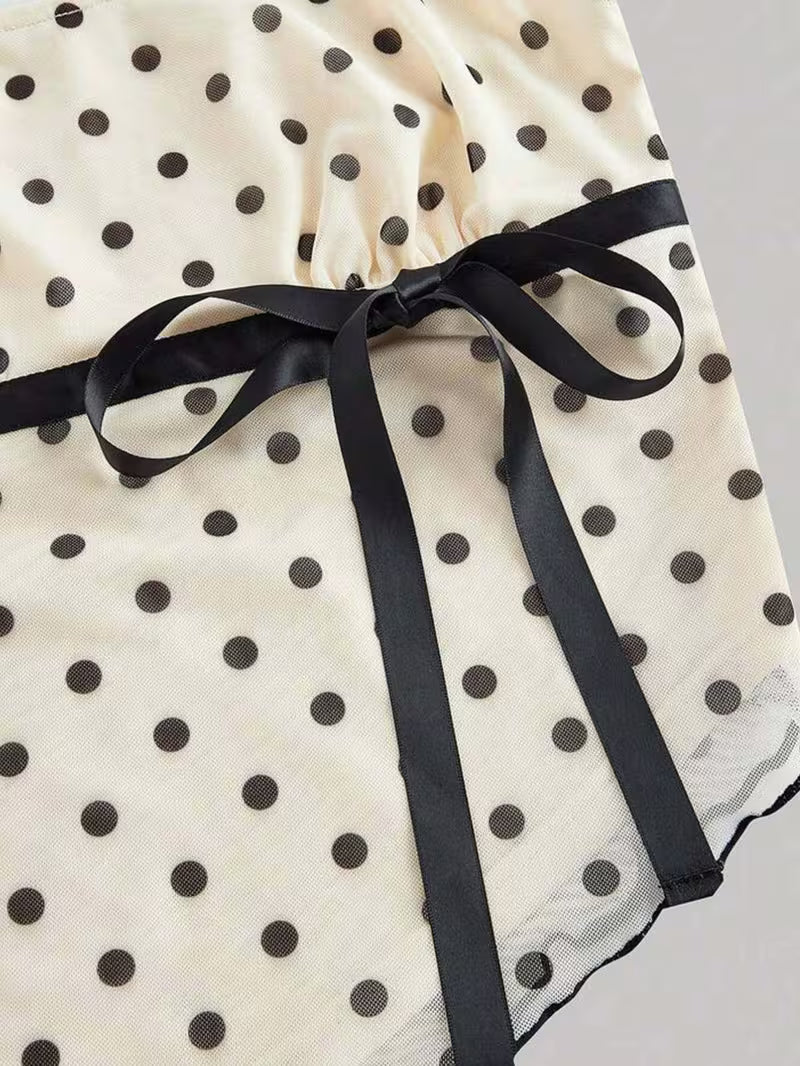 2pcs Polka Dot Skirt Set a Strappy Top with Cap Sleeves and Tie up Detailing, Paired with a Fishtail Skirt Featuring a Lace Waistband, Bow Detail and Cut-out Design. Sweet and Girly with a Retro Vibe, Perfect for Casual Attire, Commuting
