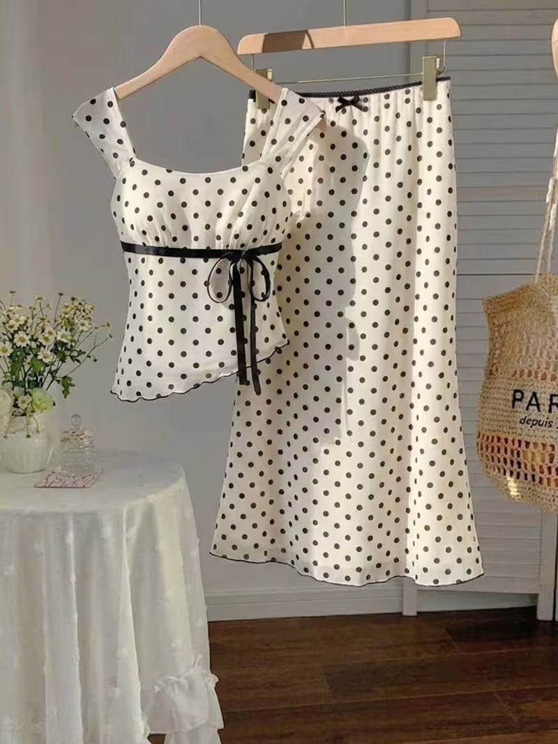 2pcs Polka Dot Skirt Set a Strappy Top with Cap Sleeves and Tie up Detailing, Paired with a Fishtail Skirt Featuring a Lace Waistband, Bow Detail and Cut-out Design. Sweet and Girly with a Retro Vibe, Perfect for Casual Attire, Commuting