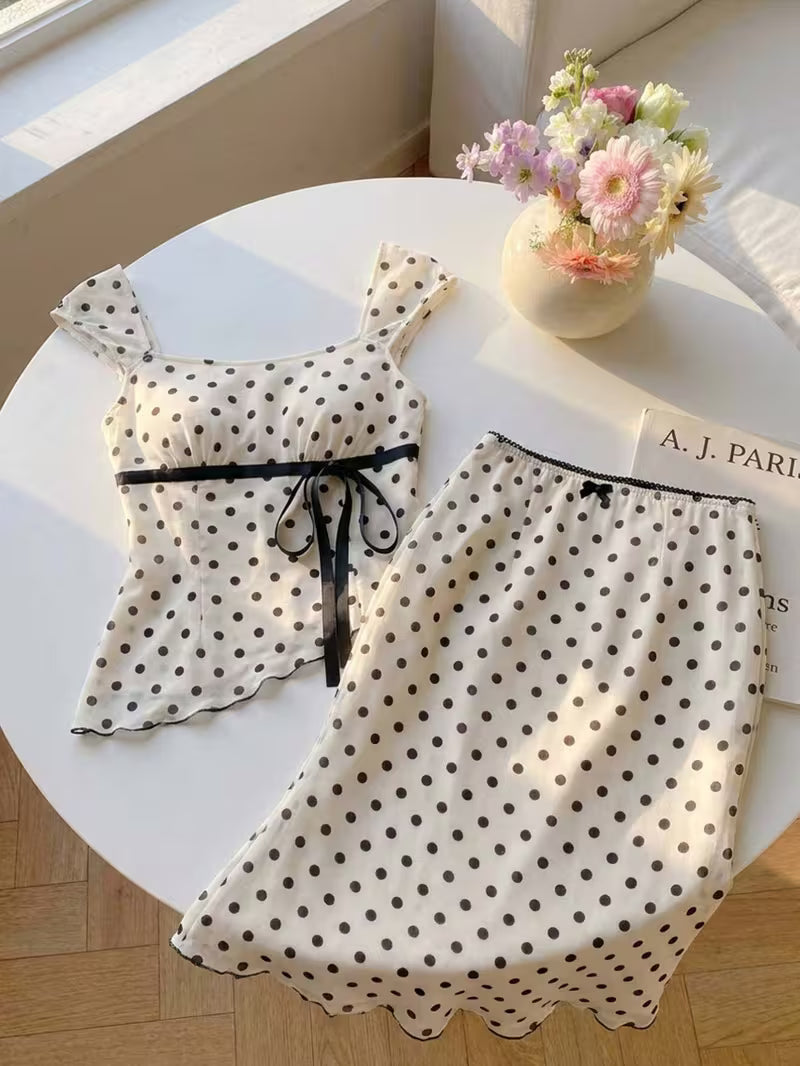 2pcs Polka Dot Skirt Set a Strappy Top with Cap Sleeves and Tie up Detailing, Paired with a Fishtail Skirt Featuring a Lace Waistband, Bow Detail and Cut-out Design. Sweet and Girly with a Retro Vibe, Perfect for Casual Attire, Commuting